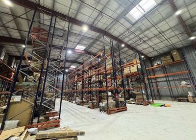 a large warehouse filled with lots of shelves and pallets