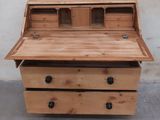 an image of a wooden desk with drawers on top of it