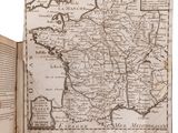 an open book with a map of france on it
