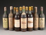 several bottles of wine sitting next to each other on a table