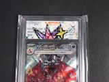 a close up of a card in a plastic case on a table