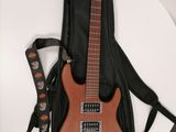 a guitar that is sitting on a table next to a guitar case