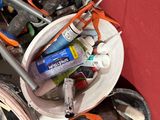 a bucket full of tools sitting on a table