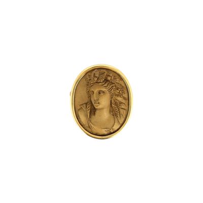 a close up of a coin with a woman ' s face on it