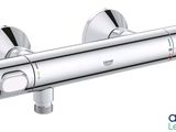 a close up of a shower faucet on a white background