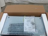 a cardboard box with a package in it sitting on the floor