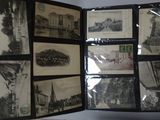 a person holding a book with pictures of buildings on it
