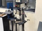 a machine that is sitting on a stand in front of a window