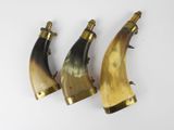 three horn shaped horns are lined up against a white background