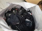 a bag of luggage sitting on the floor next to a box of luggage