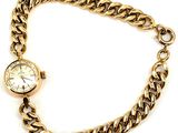 an image of a gold chain bracelet with a watch on it
