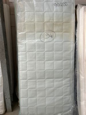 a lot of mattresses in the store for sale