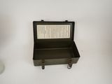 an open suitcase sitting on a table with a book in it