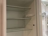 an open refrigerator that is sitting in a kitchen