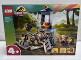 the box is open to show the contents of the lego jurassic park set