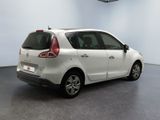 a picture of a white car parked in a garage