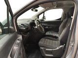 the interior of a car with the driver ' s seat folded down