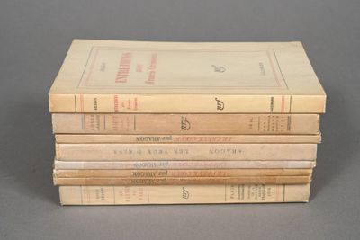 several books stacked on top of each other on a table
