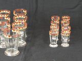 six glass vases are lined up in a row on a black background