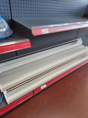 a lot of empty shelves in the store for sale