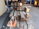 a pile of wood stacked on top of each other in a garage