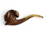 une image représentant une pipe surmontée d'une tête d'homme