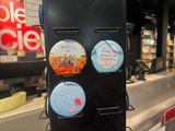 a picture of a refrigerator with magnets on it in a store