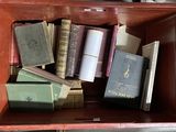 many books in a red box on the floor