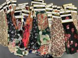 a lot of socks that are hanging on a rack