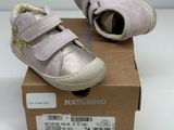 baby girl ' s shoes in a box on a white surface