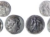 six ancient roman coins, one of which is a woman and one of which is a man