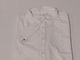 the shirt is white and has a small tag on it
