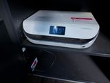 an image of a printer on a shelf in a room