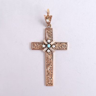 an image of a gold cross with a turquoise stone in the center