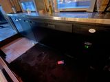 an image of a kitchen with a black counter top
