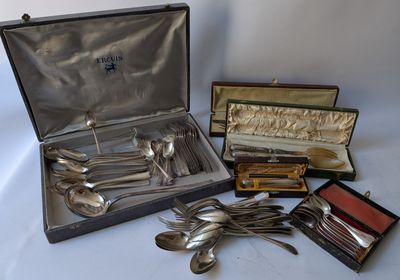 many silverware items in a case on a table