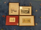 three framed pictures of boats on a blue rug on a blue floor