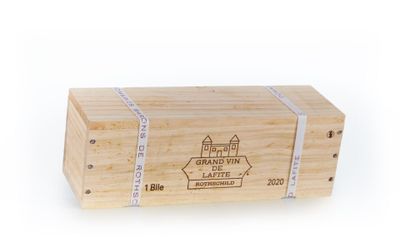 a wooden box with a label on it sitting on a white surface