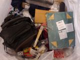 a bag full of clothes and other items in it