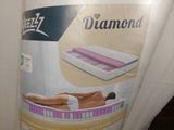 a box with a picture of a woman laying on a mattress