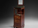 a small wooden cabinet with a mirror on top of it