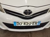 a white car with a blue license plate on it