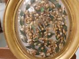 a picture of a gold plate with a bunch of nuts in it