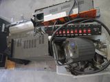 a machine that is sitting on the floor next to a box