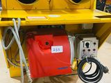 a yellow machine that is sitting on the floor