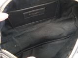 the inside of a purse with a hand holding it