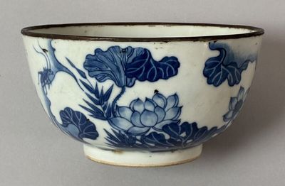 a blue and white bowl with flowers on it