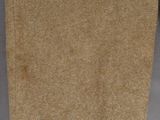 brown cloth on a gray table cloth with a brown handle