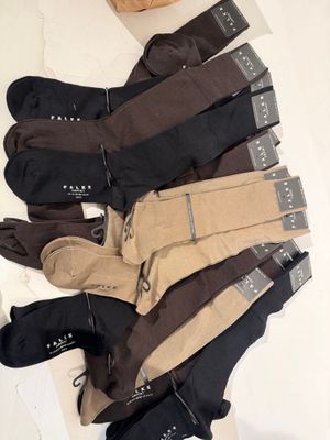 several pairs of men ' s socks are laid out on a table