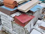 a pile of tile on the ground next to a pile of other tiles